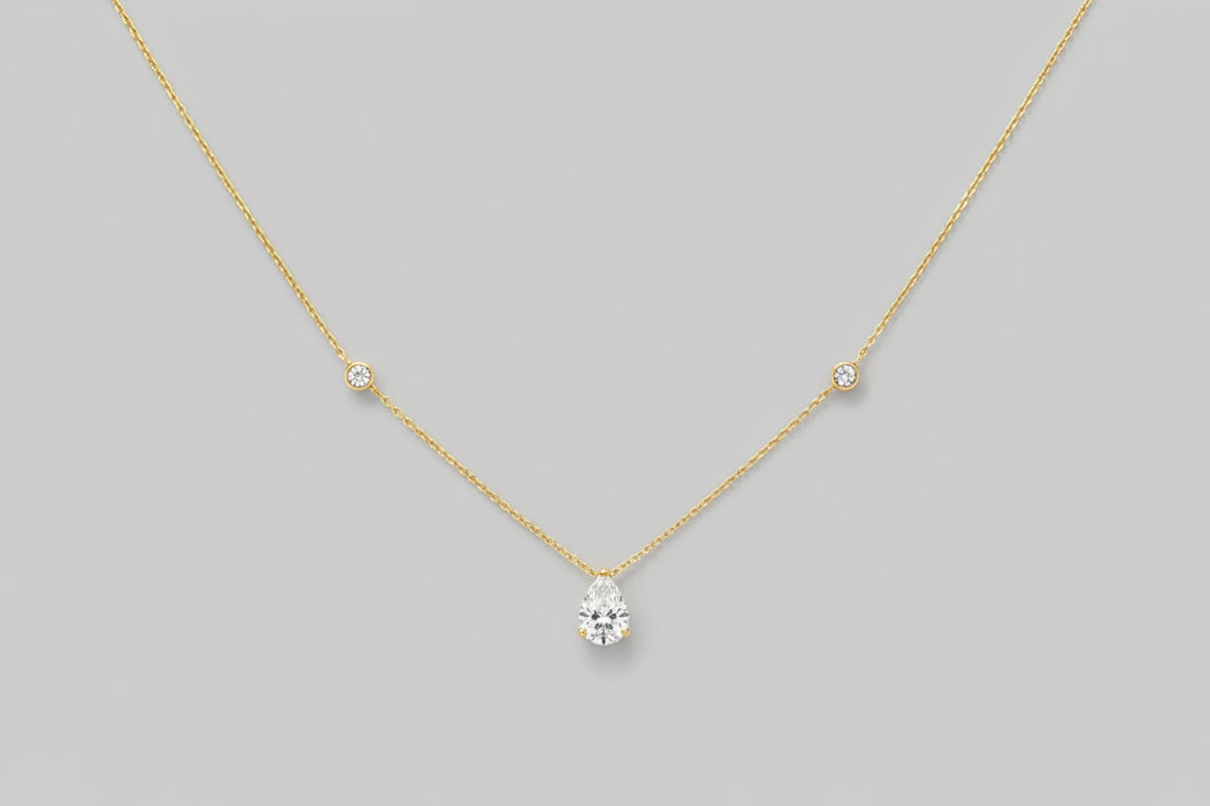 A brilliant 1.25-carat teardrop-shaped moissanite pendant on an 18K gold-plated 925 sterling silver chain