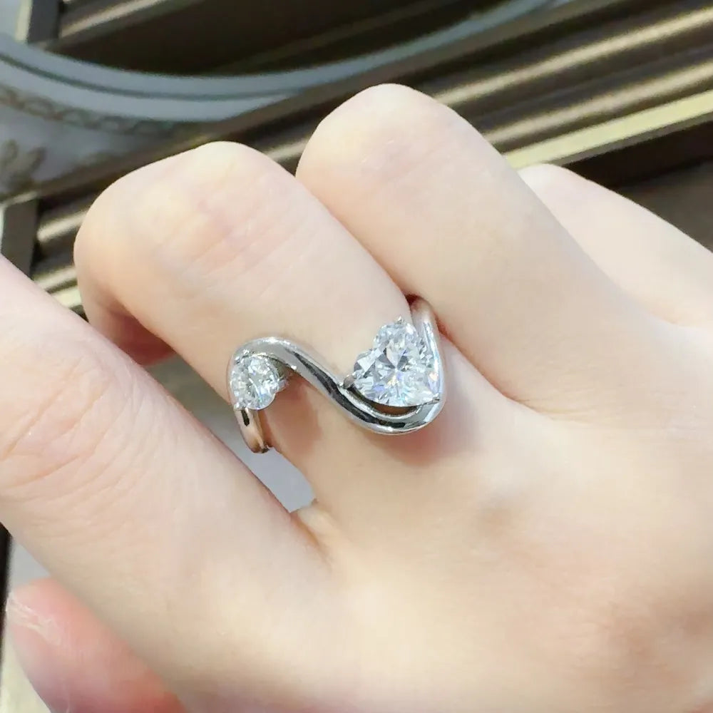 1.3 carat moissanite irregular shape ring in a high-polish 925 sterling silver setting.