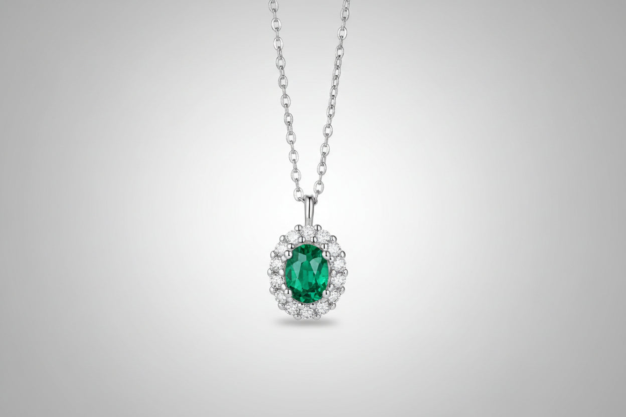1.5 carat lab-grown emerald pendant with zircon accents on a platinum-plated 925 sterling silver chain.