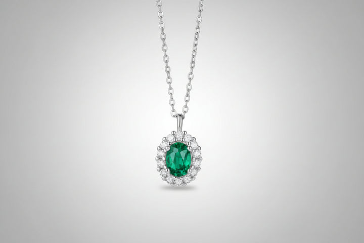 1.5 carat lab-grown emerald pendant with zircon accents on a platinum-plated 925 sterling silver chain.