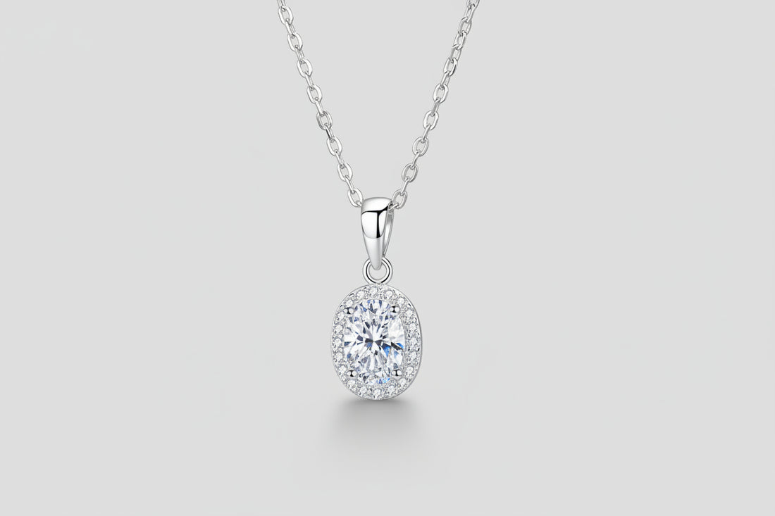 A 1-carat round moissanite pendant on a rhodium-plated 925 sterling silver chain.
