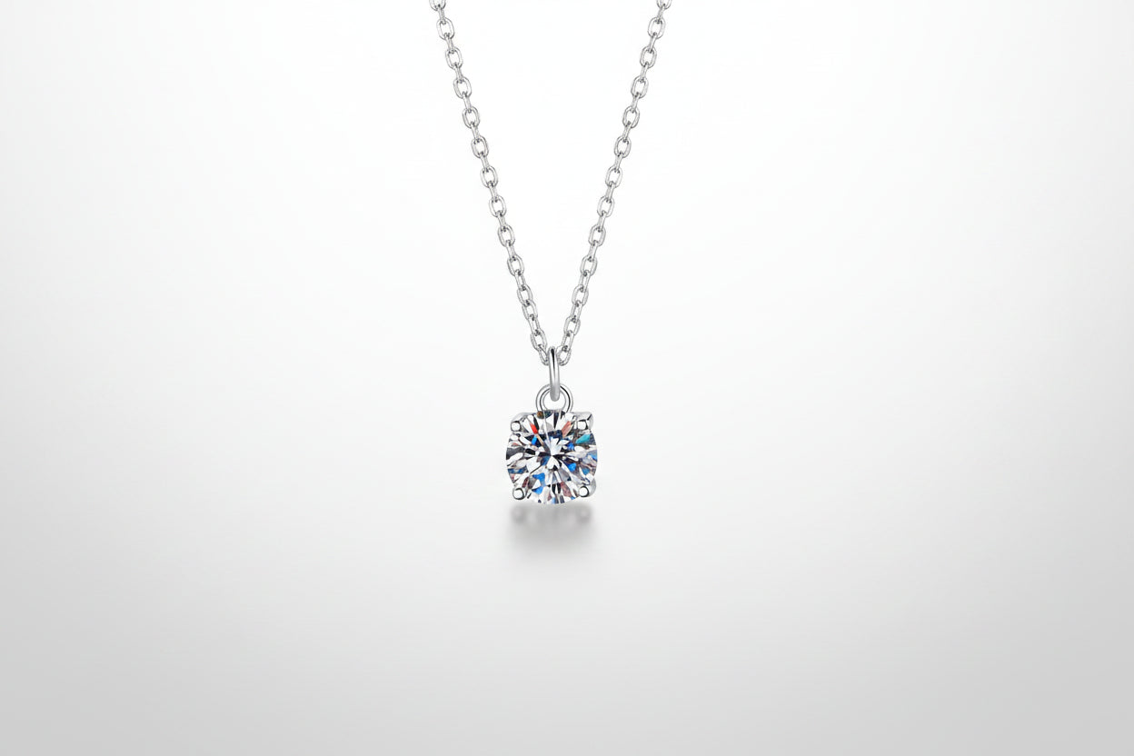 A brilliant 1-carat round moissanite pendant on an adjustable 925 sterling silver chain.