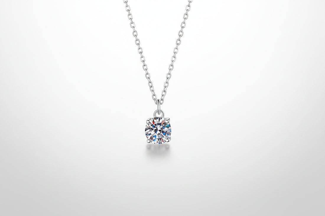 A brilliant 1-carat round moissanite pendant on an adjustable 925 sterling silver chain.