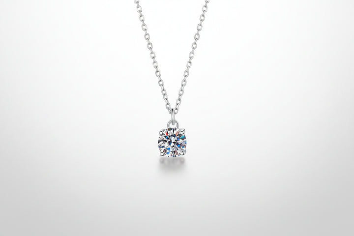 A brilliant 1-carat round moissanite pendant on an adjustable 925 sterling silver chain.