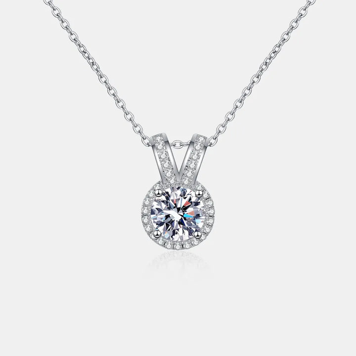1-carat round cut moissanite pendant with rabbit ear setting in 925 sterling silver.