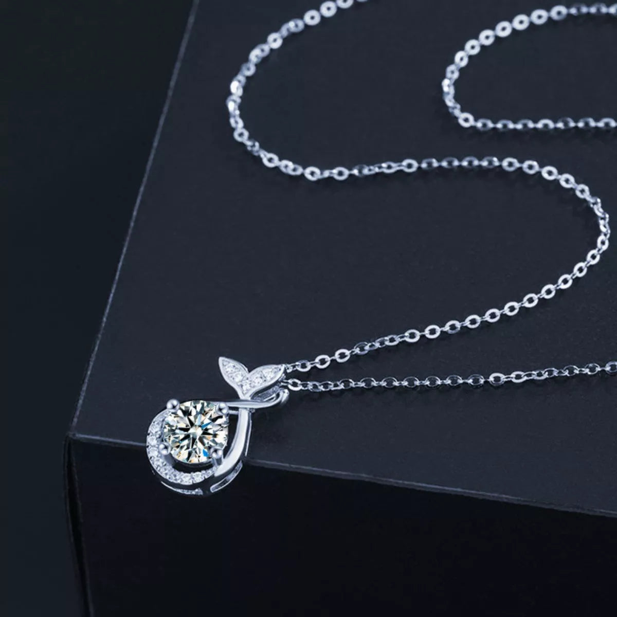 1-carat round cut moissanite solitaire pendant necklace in platinum-plated 925 silver.