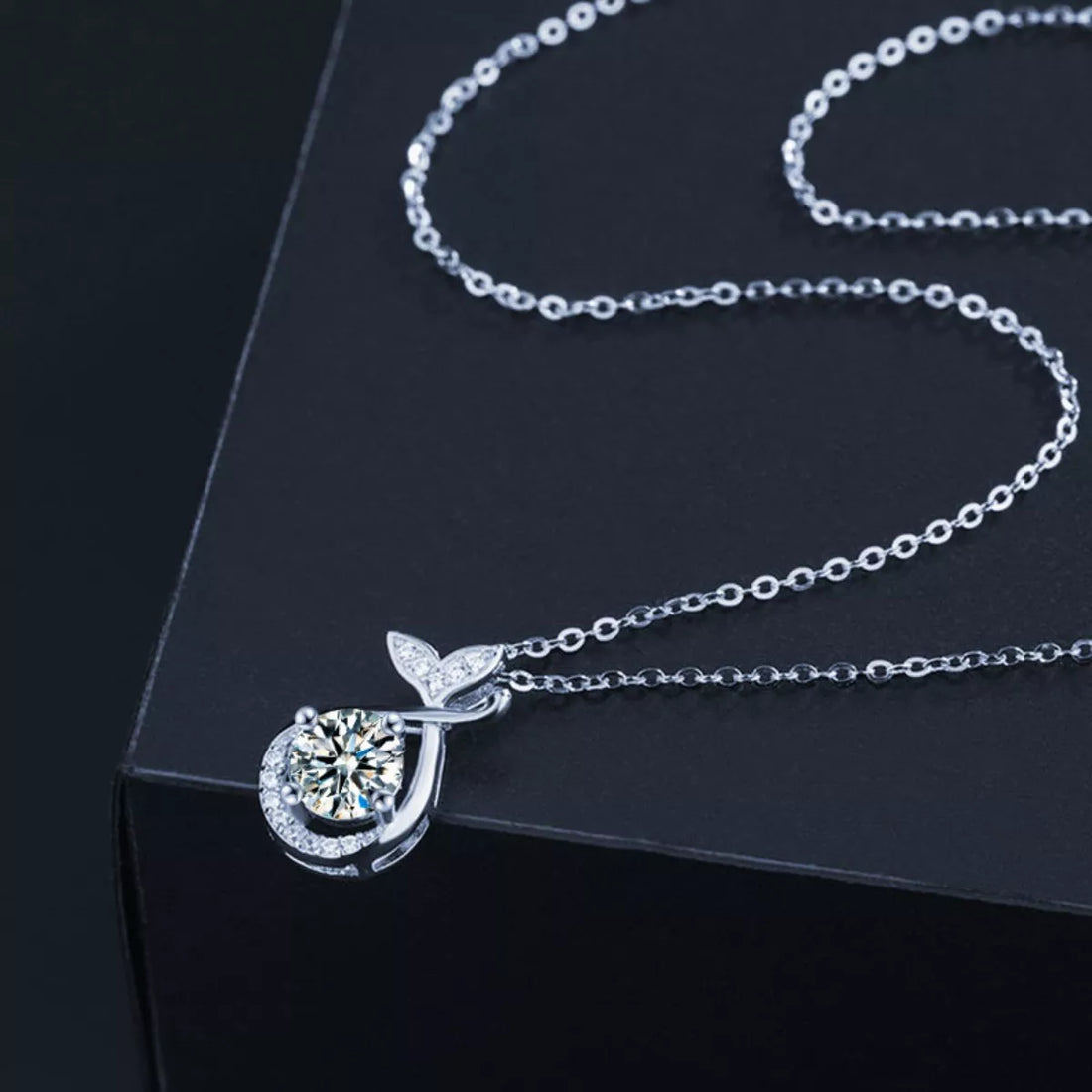 1-carat round cut moissanite solitaire pendant necklace in platinum-plated 925 silver.