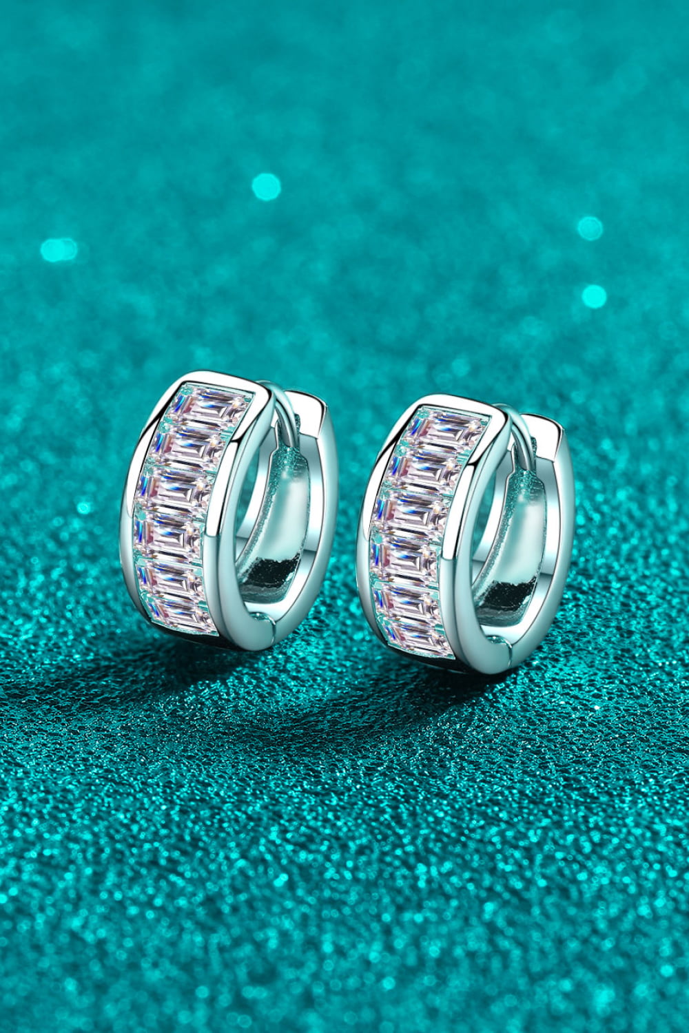 1.8-carat total weight moissanite huggie earrings in rhodium-plated silver.