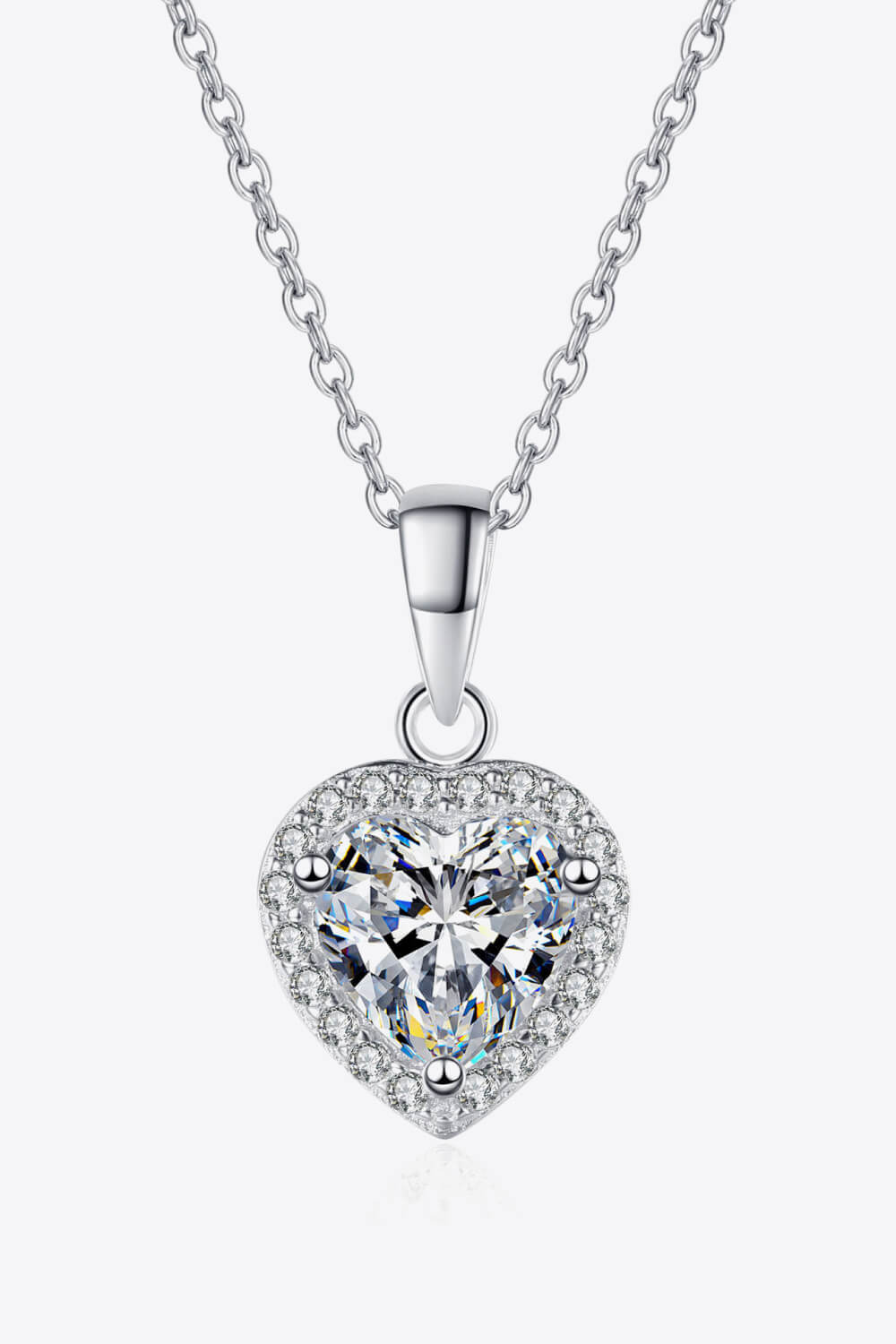 : A brilliant 1 carat heart-shaped moissanite ring in a polished 925 sterling silver setting.