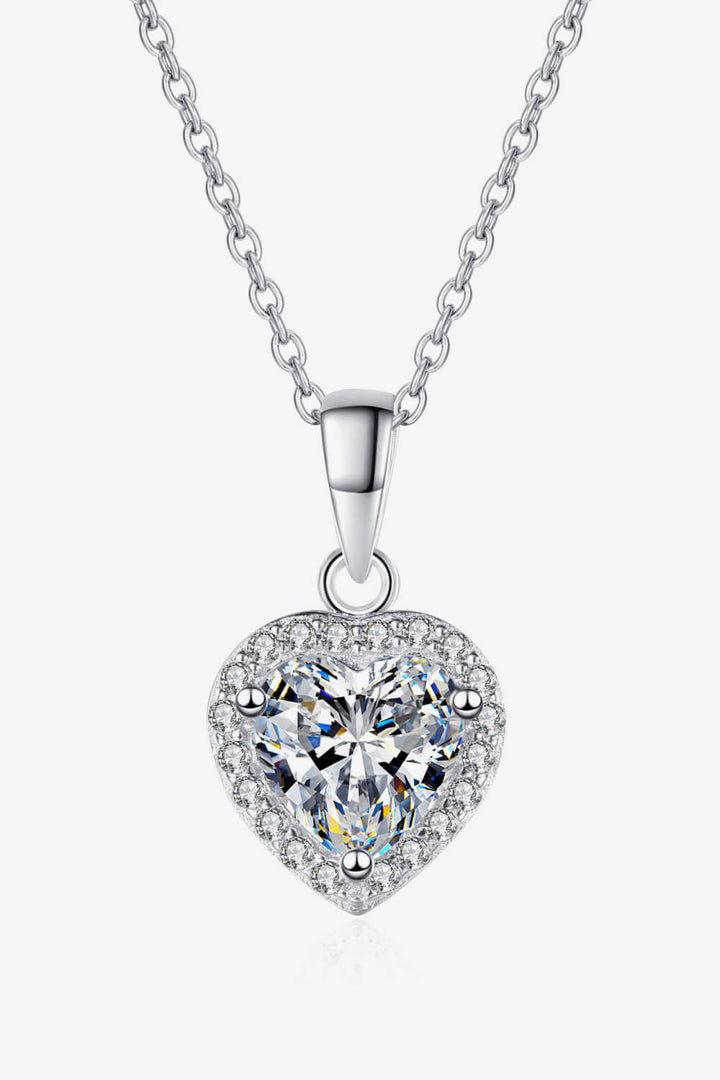 : A brilliant 1 carat heart-shaped moissanite ring in a polished 925 sterling silver setting.