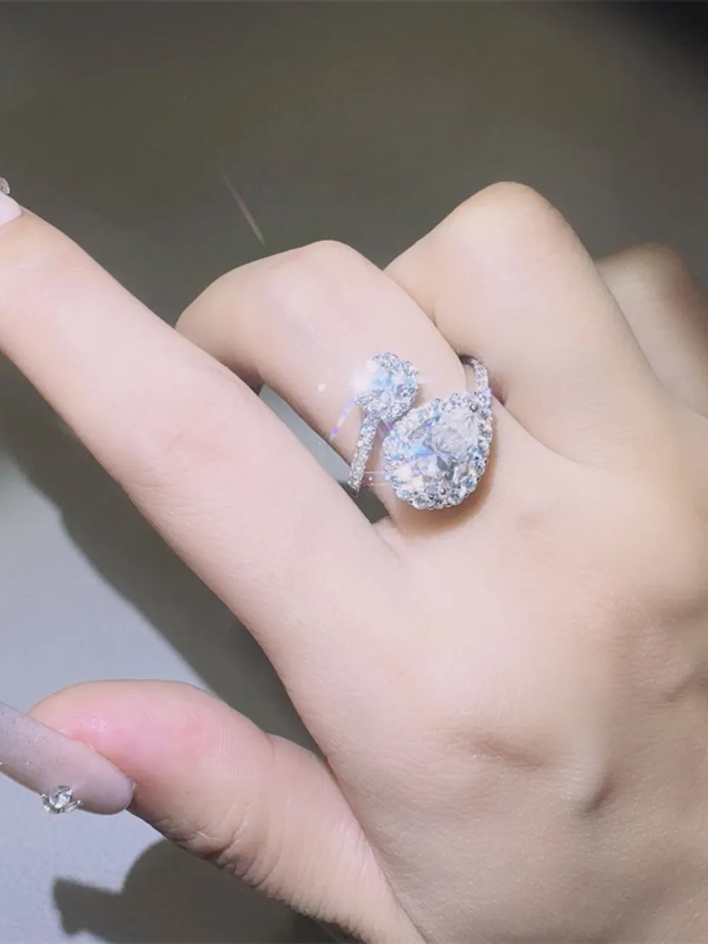 2-carat moissanite bypass ring in platinum-plated 925 sterling silver.