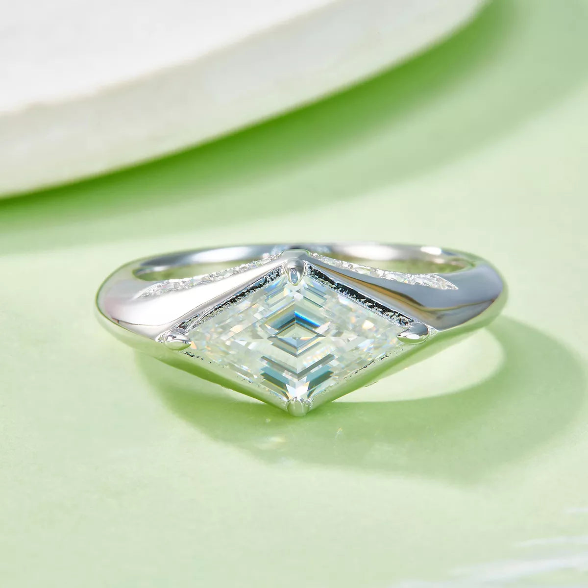2-carat round cut moissanite solitaire ring in platinum-plated 925 sterling silver.