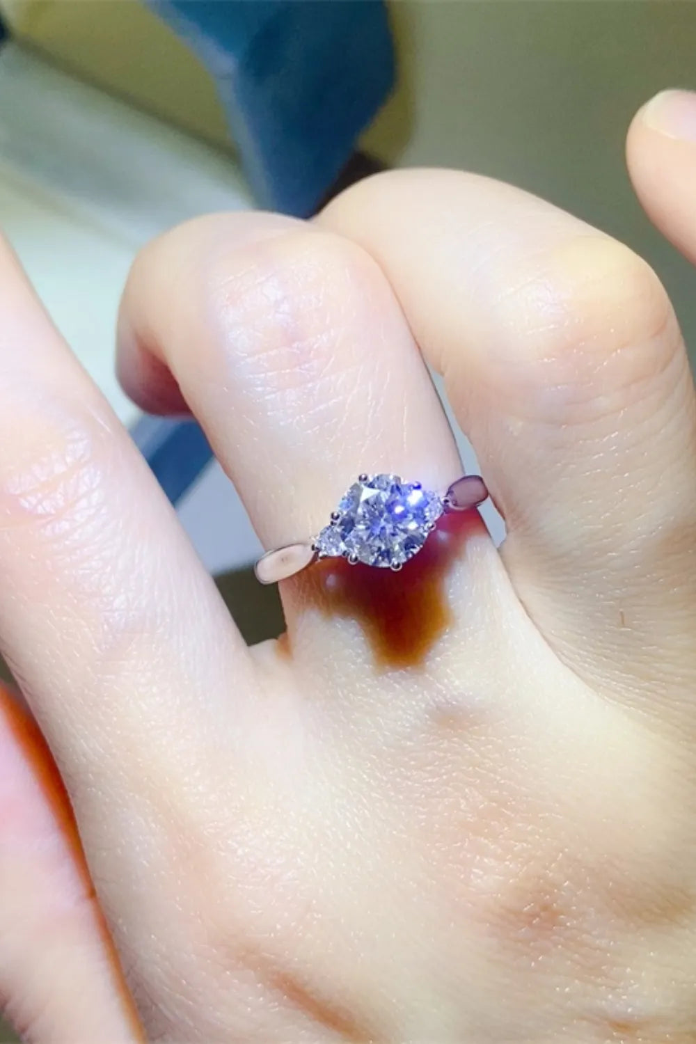2-carat round cut moissanite solitaire ring in 925 sterling silver.