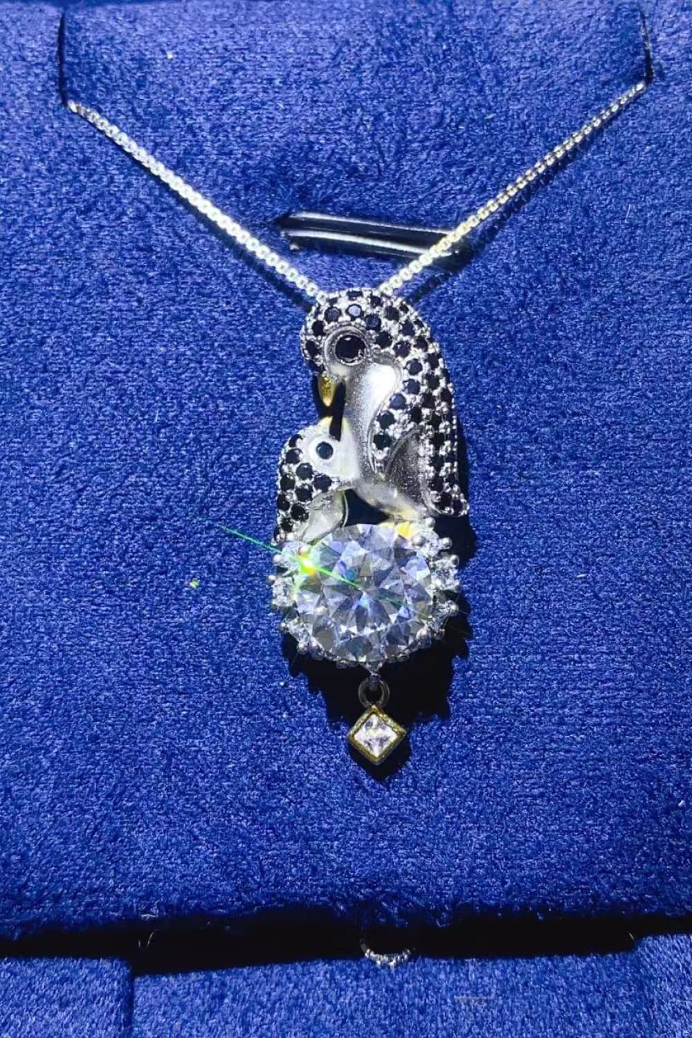 2-carat round moissanite solitaire pendant necklace in platinum-plated 925 silver.