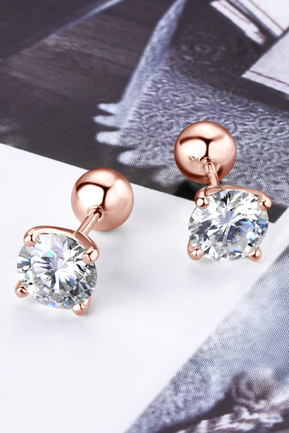 2-carat total weight moissanite stud earrings in platinum-plated 925 sterling silver.