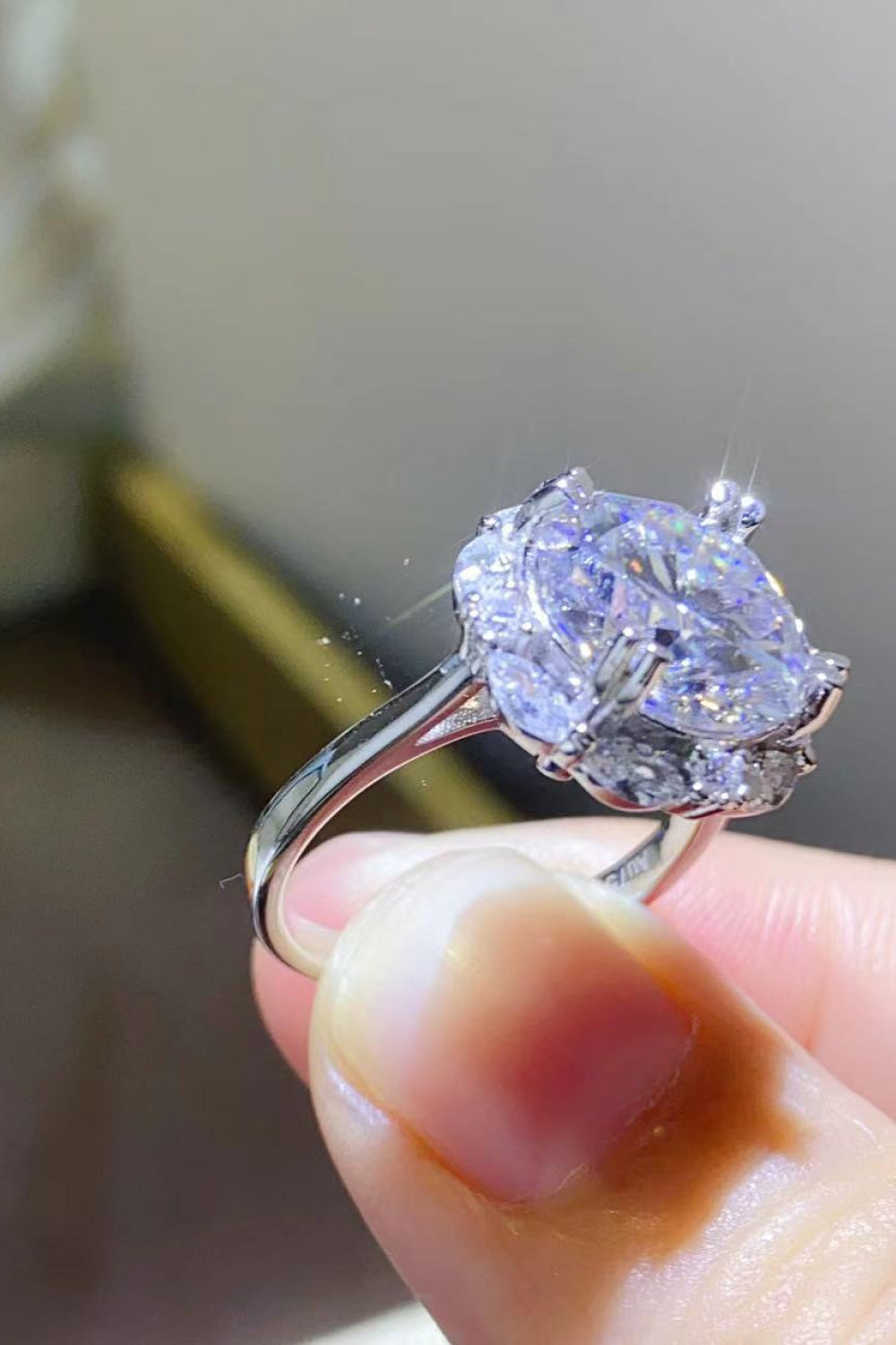 5-carat round cut moissanite solitaire ring in platinum-plated 925 sterling silver.