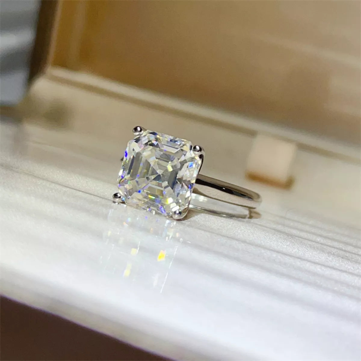 5-carat round cut moissanite solitaire ring in platinum-plated 925 sterling silver.