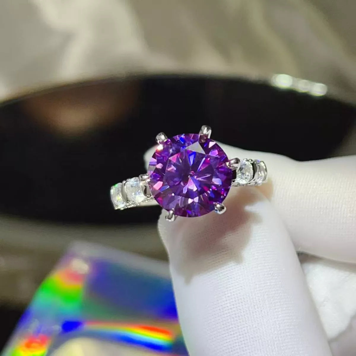 5-carat round cut moissanite solitaire ring with a 6-prong setting in platinum-plated 925 silver.