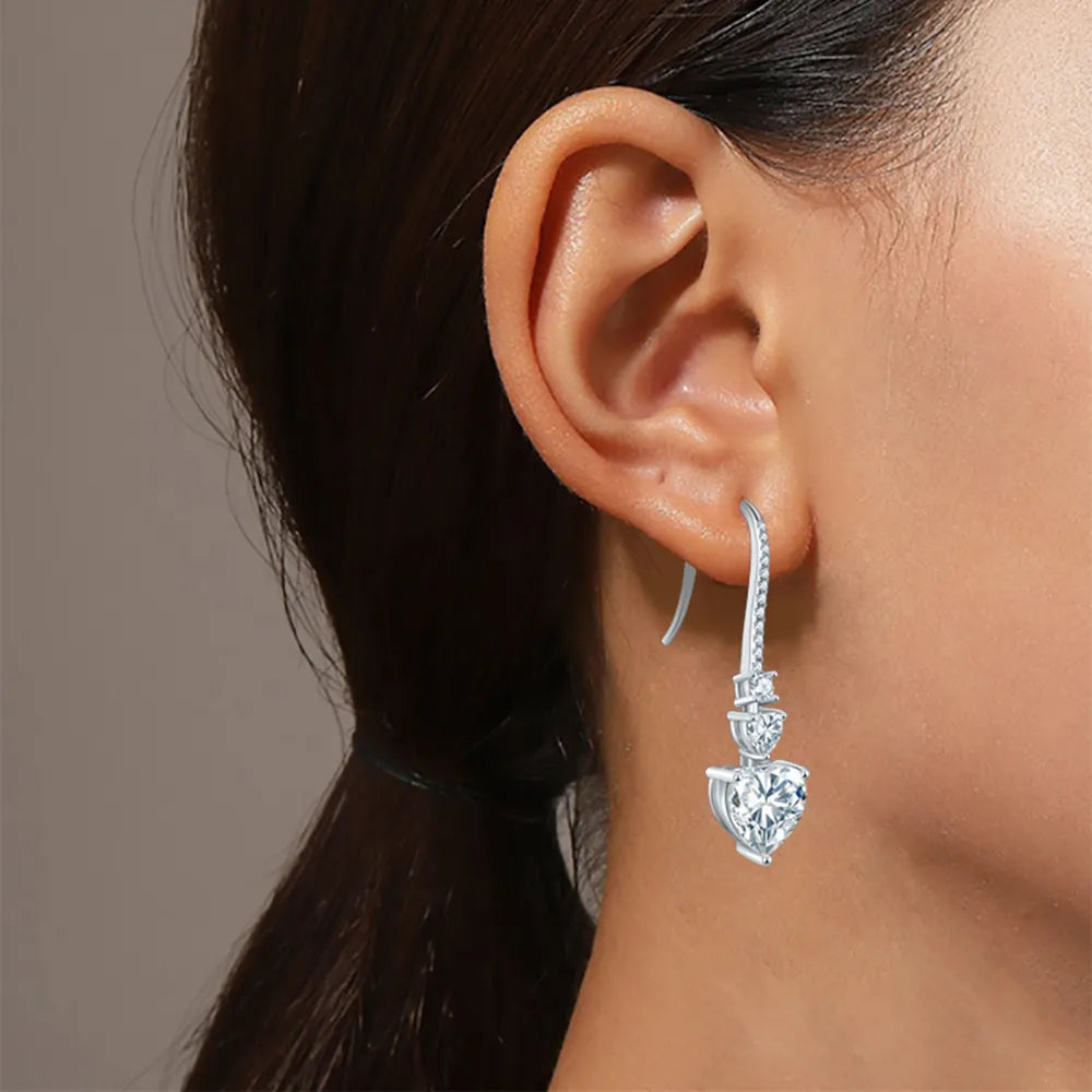 5.44-carat total weight heart-shaped moissanite drop earrings in 925 sterling silver.