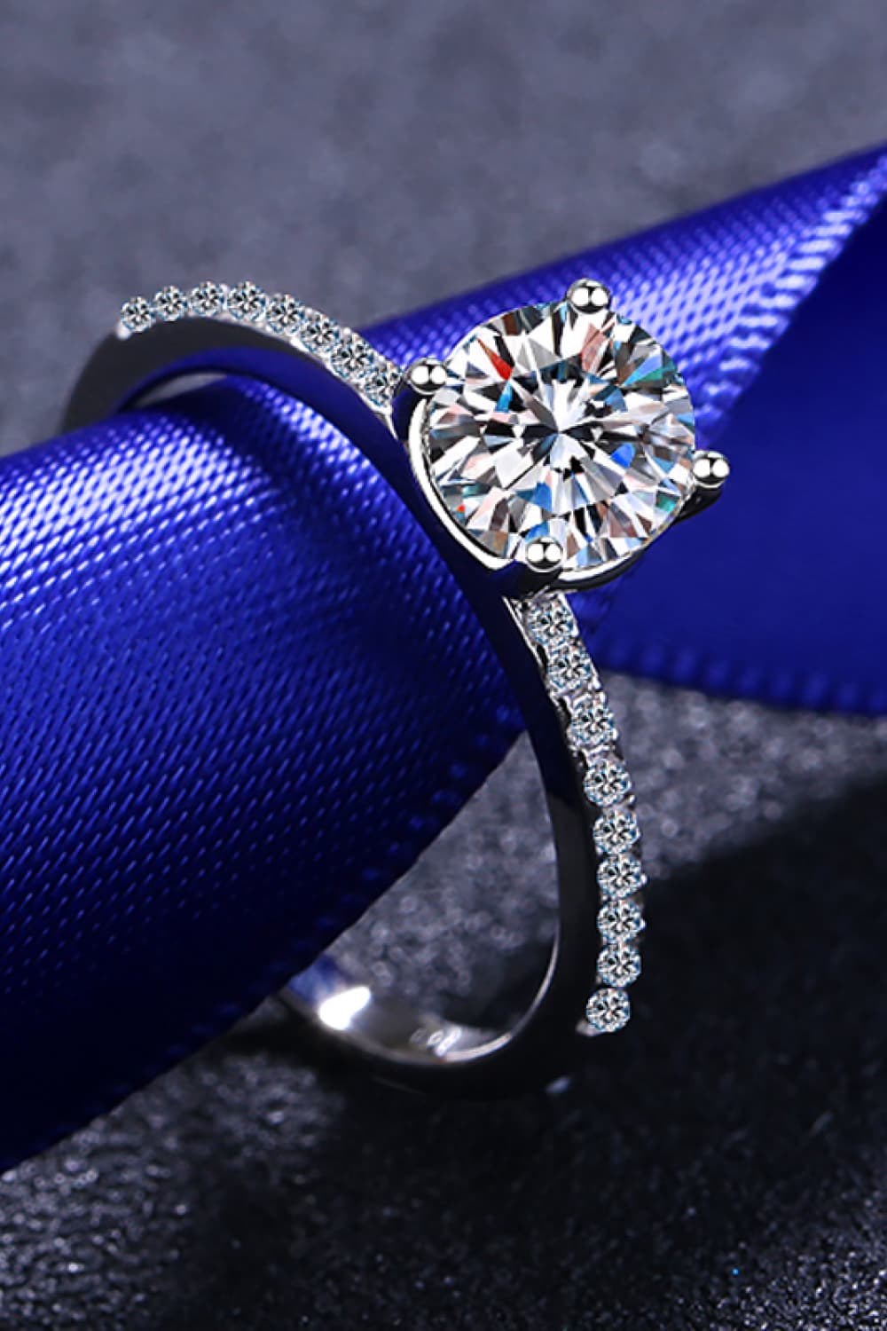 925 sterling silver hallmark on the inner band of a rhodium-plated moissanite ring.