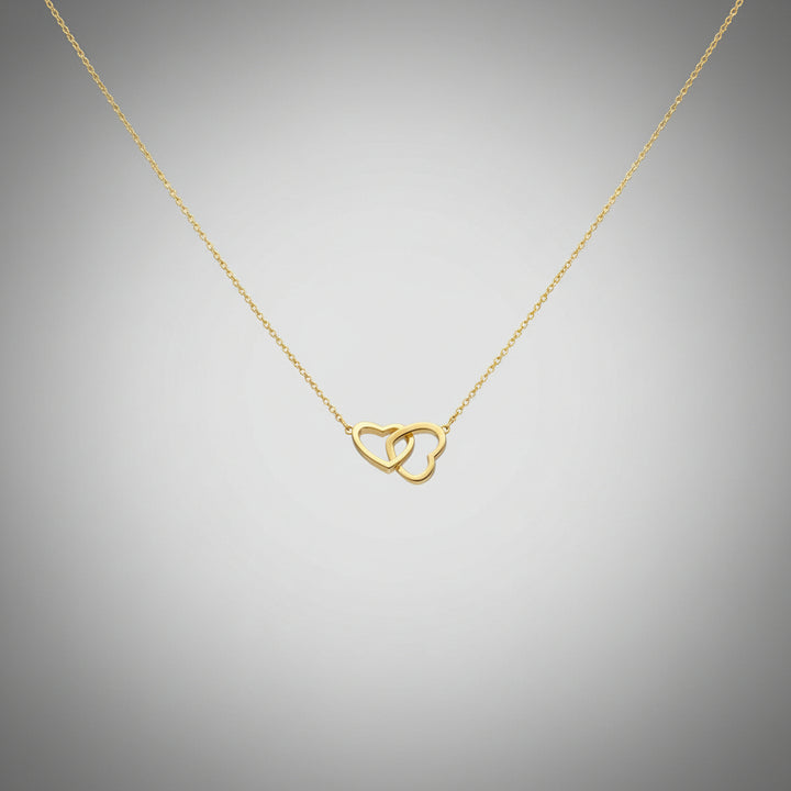 Interlocking heart pendant necklace in 18K gold plated 925 sterling silver.
