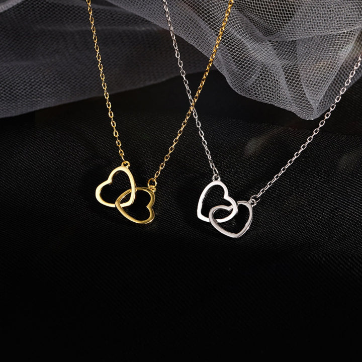 Interlocking heart pendant necklace in 18K gold plated 925 sterling silver.